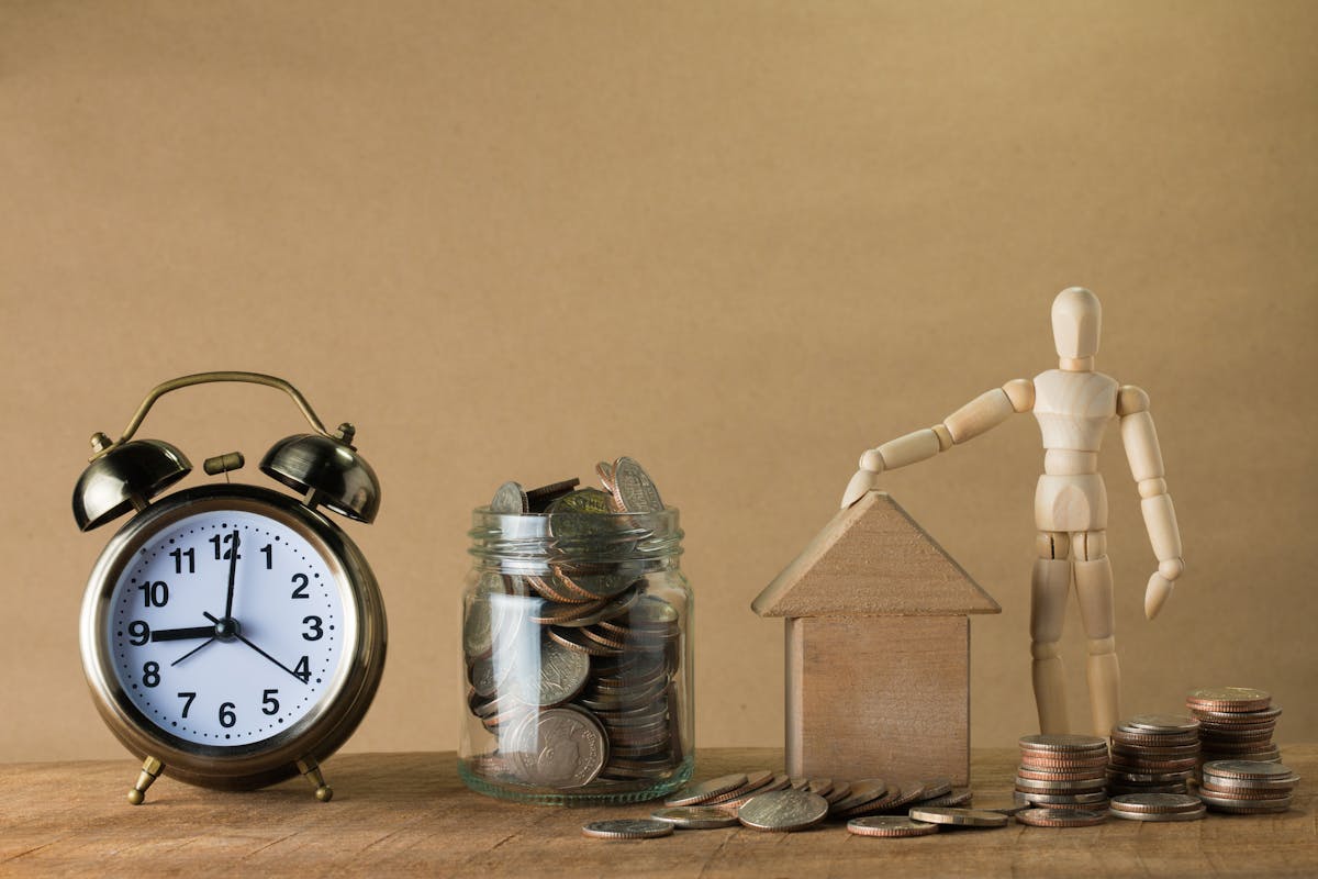 Clock and stacks of money symbolizing long-term mortgage contract and compounding interest over time
